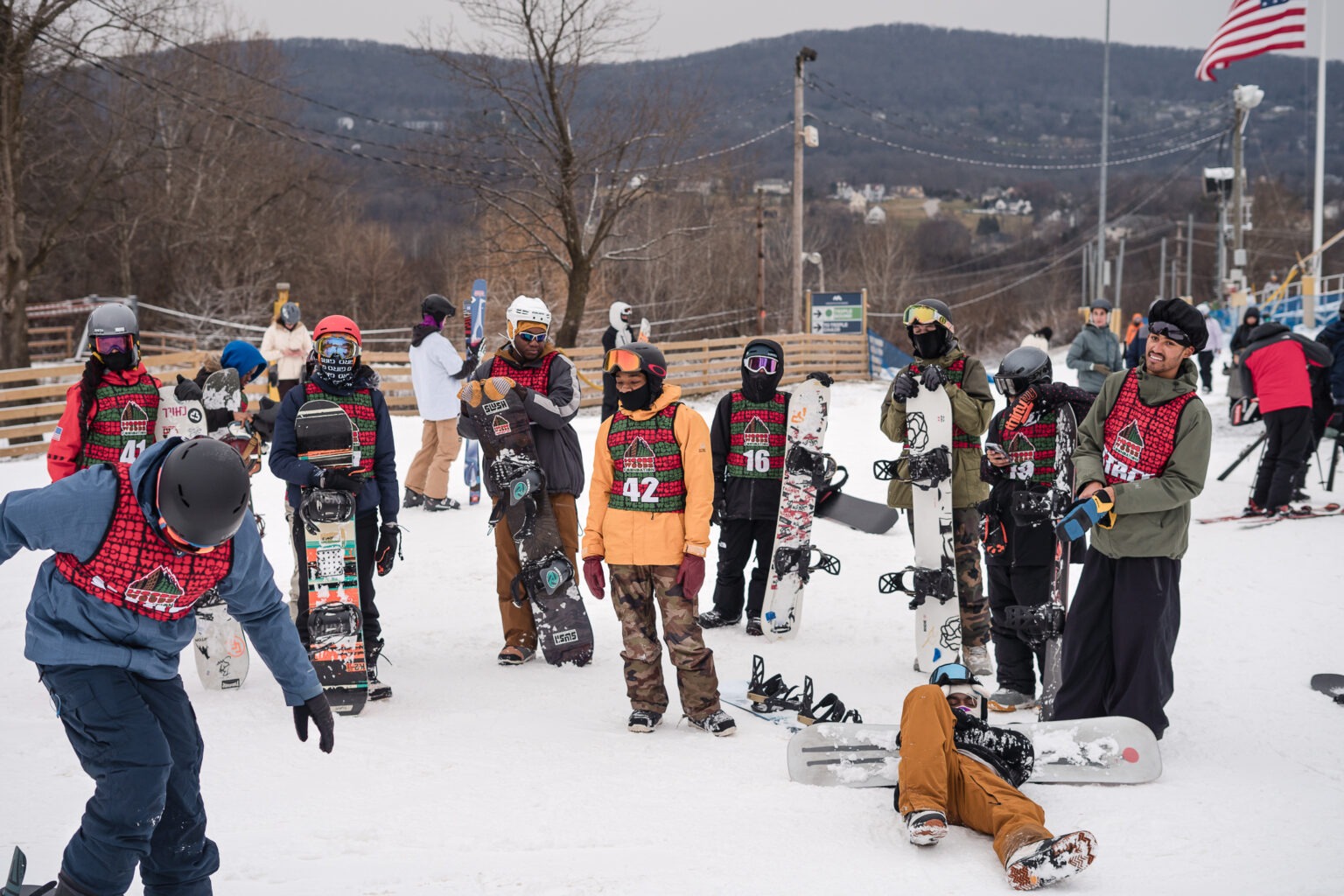 Home Page 3 Hoods to Woods participants preparing to snowboard